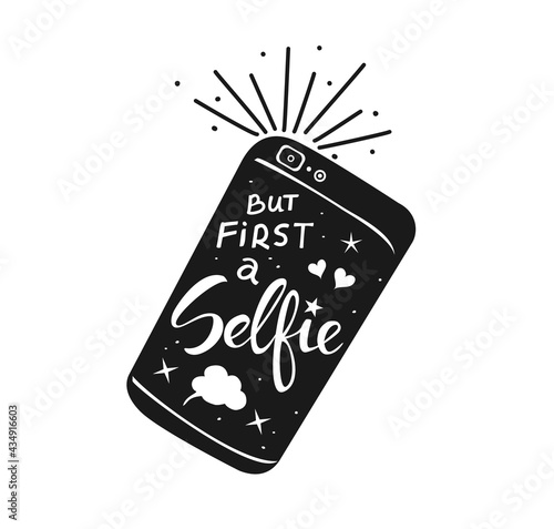 but first selfie hand written quote on a smartphone in black and white