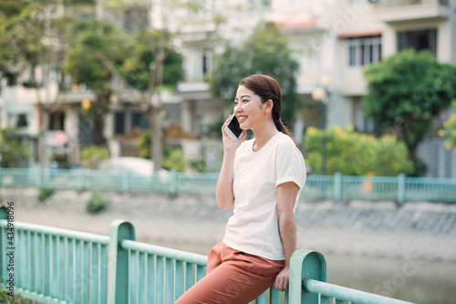 Young Beautiful Woman Talking On Mobile Phone Outdoor.