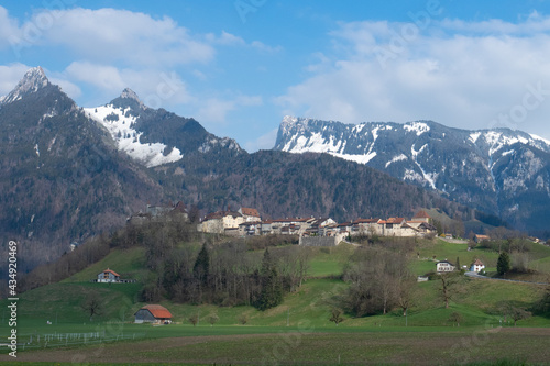 Historic town and Chateau de Gruyeres, Switzerland, in front of the mountains