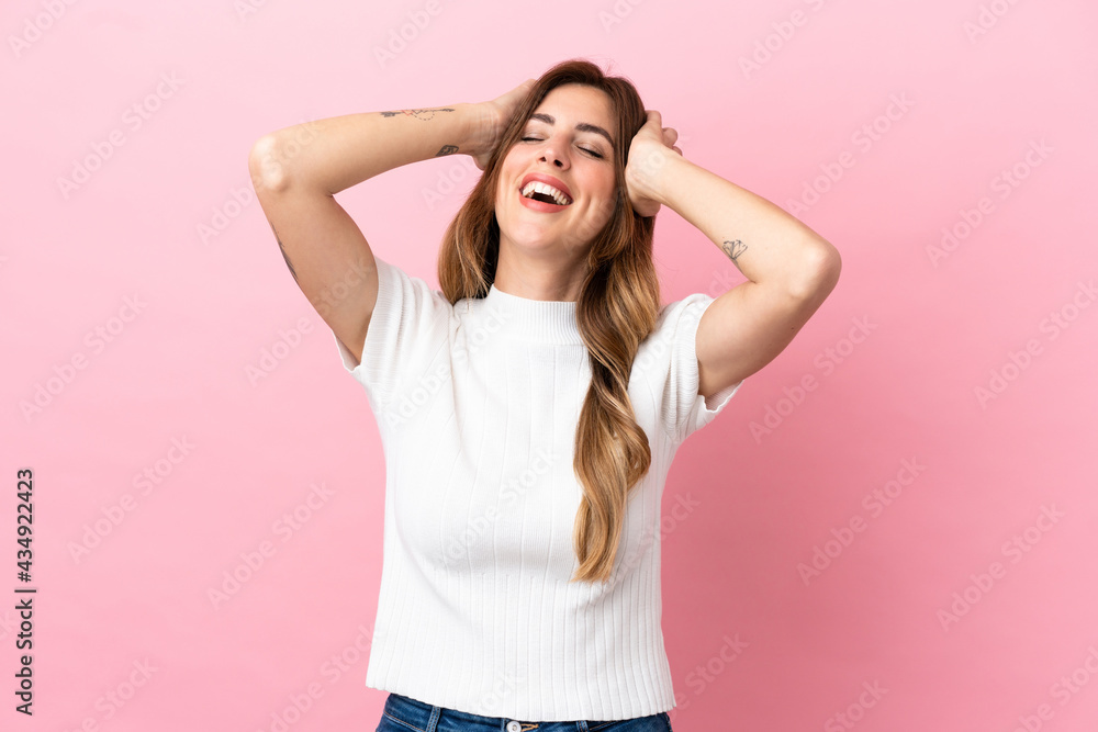 Caucasian woman isolated on pink background laughing Caucasian woman isolated on pink background laughing