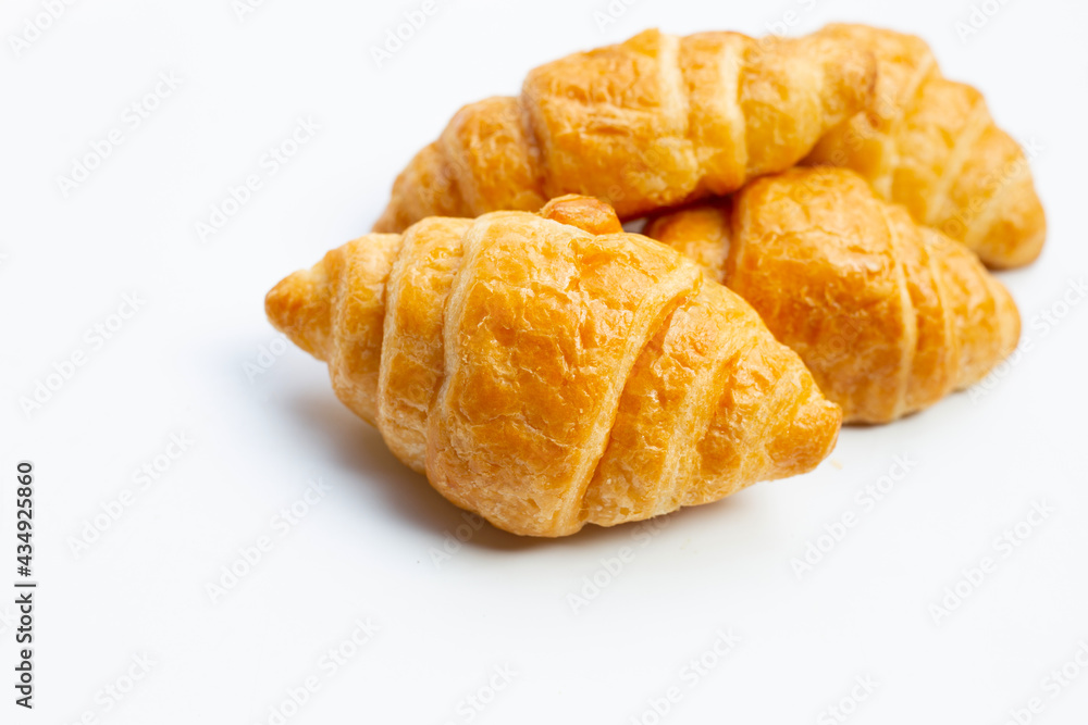 Tasty croissants on white background.