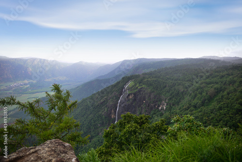 Spectacular view of a mountain and the waterfall during monsoon. A scenic site from Munar, Kerala, India. © Telsa
