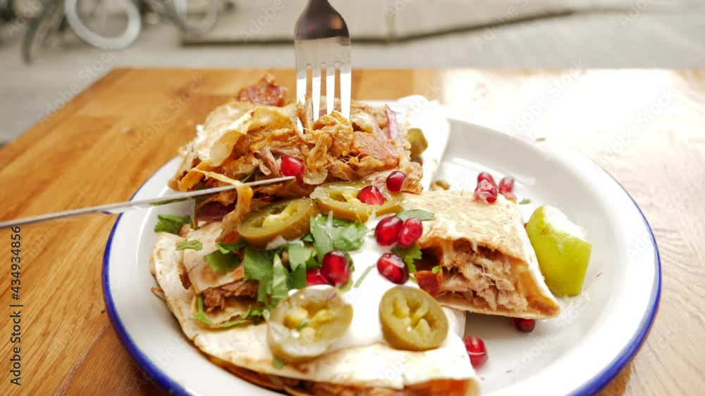 Eating quesadilla in traditional mexican cuisine restaurant outdoor terrace Eating quesadilla in traditional mexican cuisine restaurant outdoor terrace