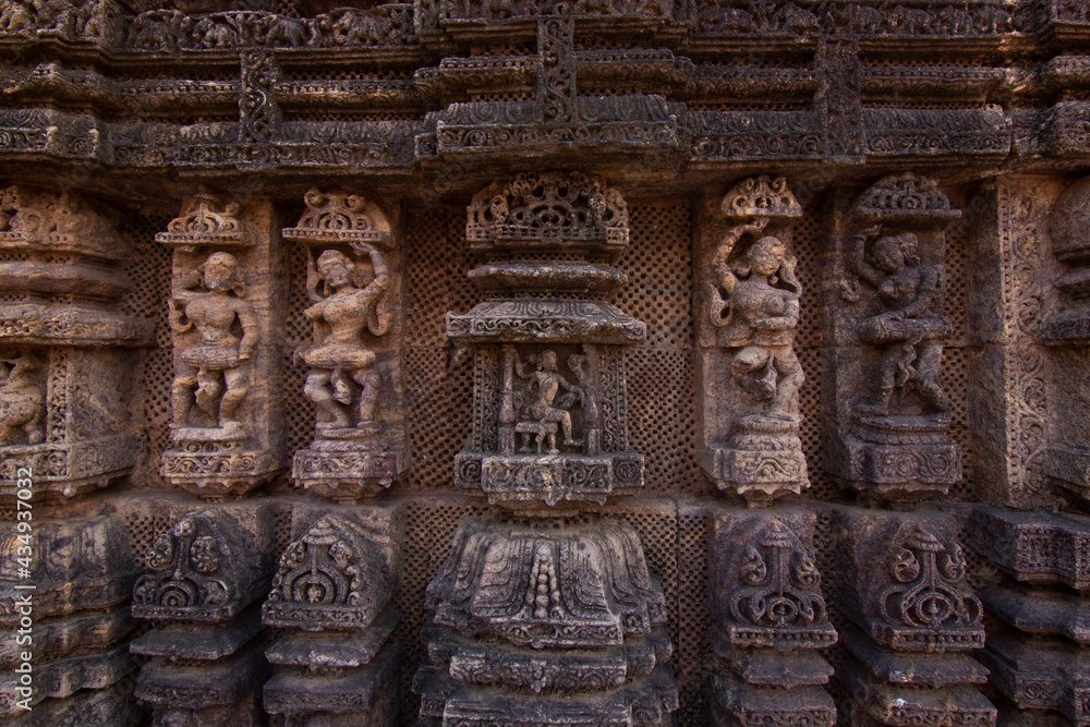 Intricate carvings on a stone wheel in the ancient Hindu 13th Century AD Sun Temple at Konark, Odisha, India. Intricate carvings on a stone wheel in the ancient Hindu 13th Century AD Sun Temple at Konark, Odisha, India.