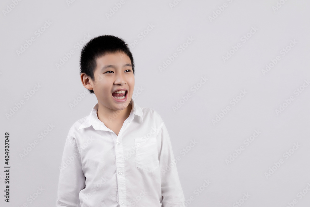 Asian boys studio portrait on gray background Asian boys studio portrait on gray background