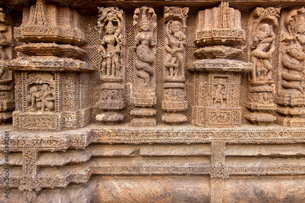 Ancient sandstone carvings on the walls of the ancient sun temple at Konark, India. temple of india