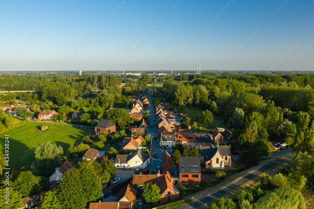 Aerial view of the Flemish village of Vlassenbroek, near Dendermonde, on a warm summer evening