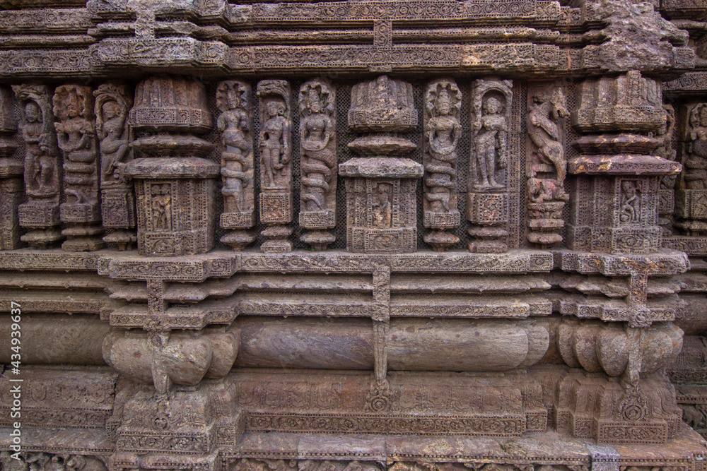 Ancient sandstone carvings on the walls of the ancient 13th-century CE Konark sun temple in Odisha , India. Ancient sandstone carvings on the walls of the ancient 13th-century CE Konark sun temple in Odisha , India.
