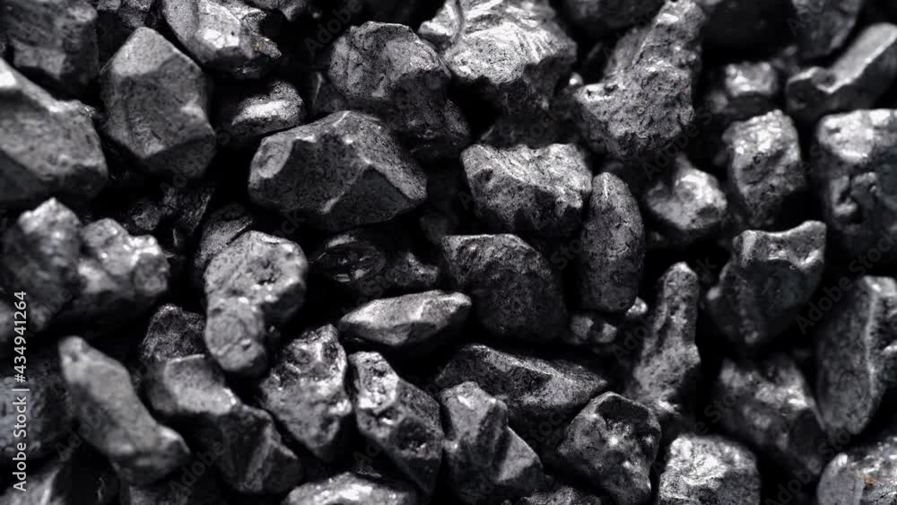 Stone ore close-up. Black stones grunge background. Stone ore close-up. Black stones grunge background.