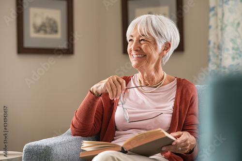 Happy senior woman smiling at home photo