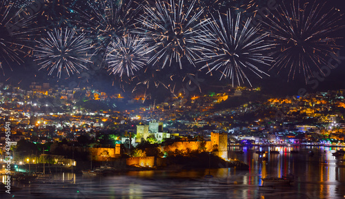 Aerial view of Bodrum resort town on Turkish Riviera at night with fireworks - Bodrum, Turkey