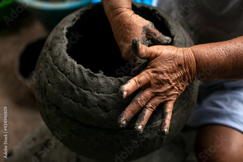 Hands of women craftsmen making clay vessels. These women are cultural living heritage of the fishing community of Manicuare in Venezuela.