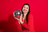 Photo of sweet brunette lady hold disco ball wear red dress isolated on vivid color background