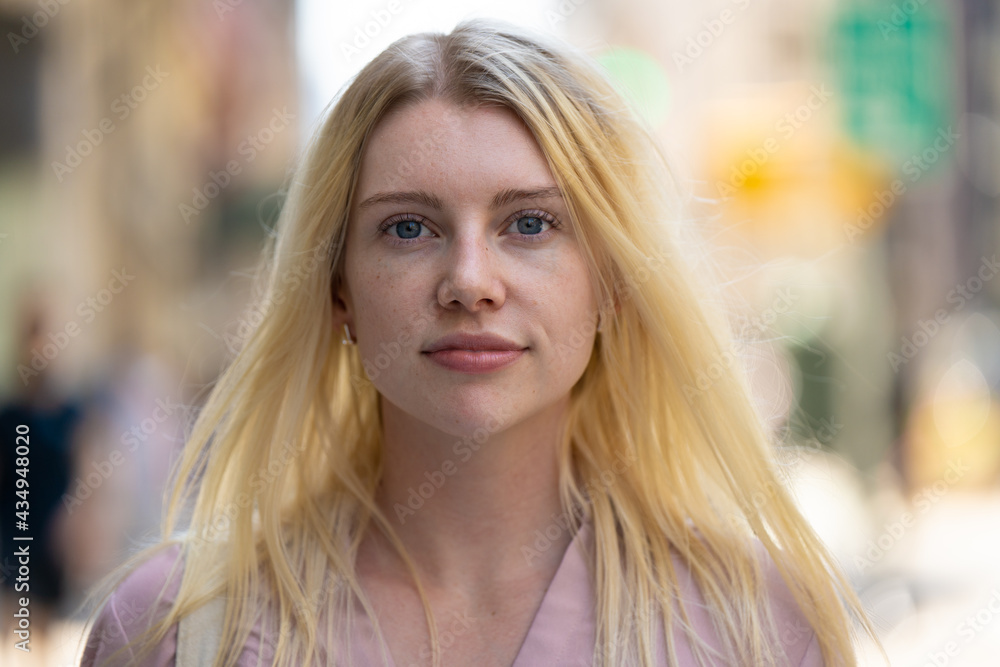 Young caucasian woman in city serious face portrait Young caucasian woman in city serious face portrait