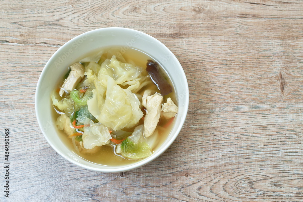 boiled cabbage and mixed vegetable with chicken soup on bowl boiled cabbage and mixed vegetable with chicken soup on bowl