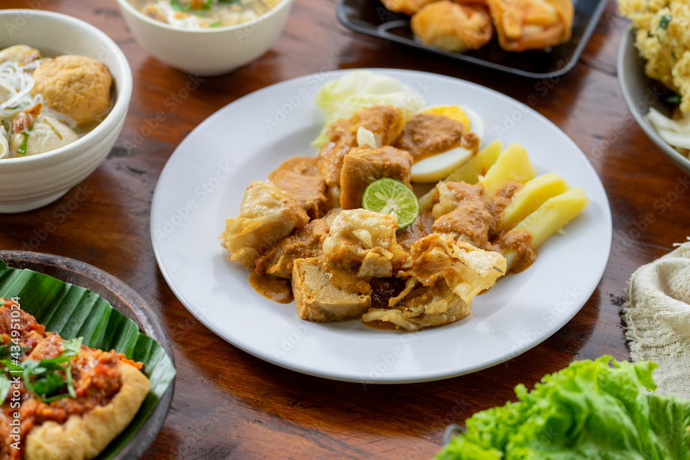 Indonesian specialities made from tofu are served on the table. Indonesian specialities made from tofu are served on the table.