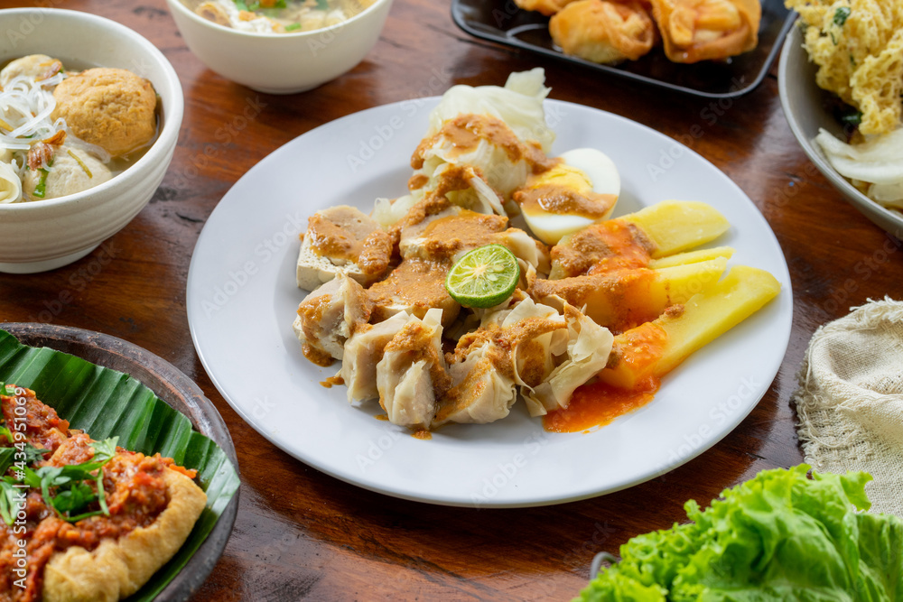 Indonesian specialities made from tofu are served on the table. Indonesian specialities made from tofu are served on the table.