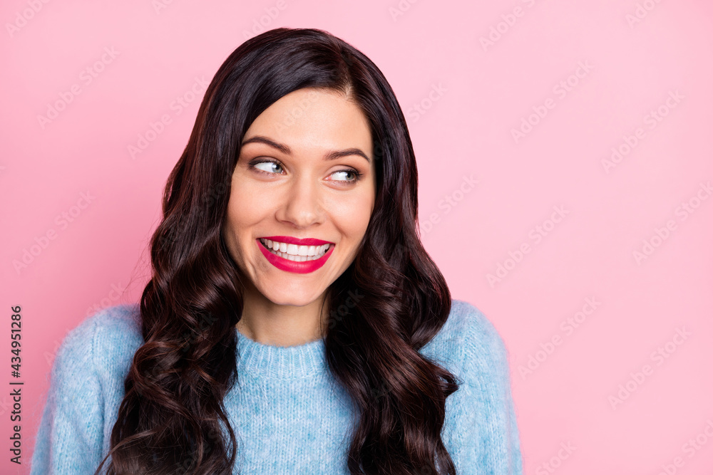 Portrait of satisfied gorgeous girl look empty space toothy smile wear pullover isolated on pink color background Portrait of satisfied gorgeous girl look empty space toothy smile wear pullover isolated on pink color background