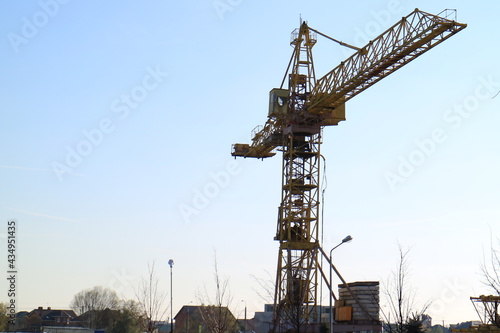 Tower cranes are working on the construction of a new house. Lifting crane. © PhotoBetulo