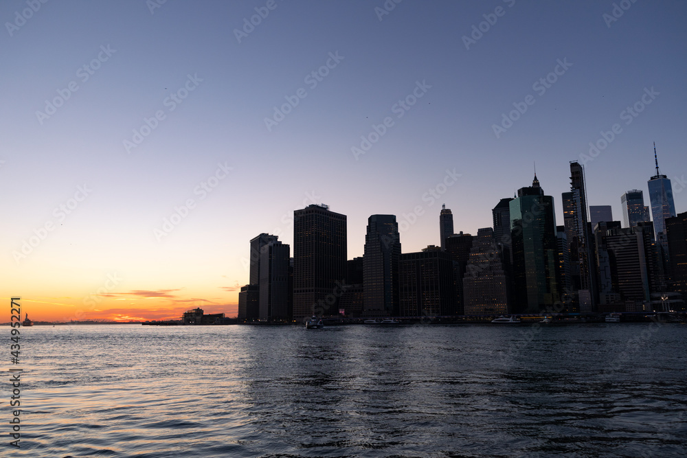 Dark Lower Manhattan Skyline after a Sunset along the East River in New York City