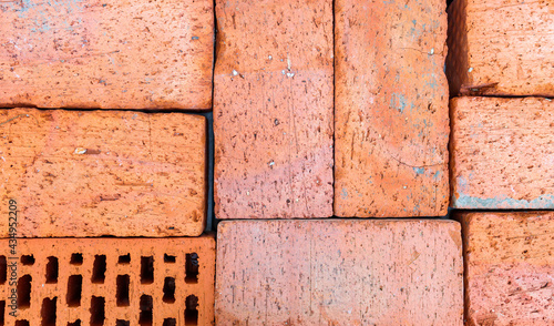 red bricks stacked on top of each other close-up photo