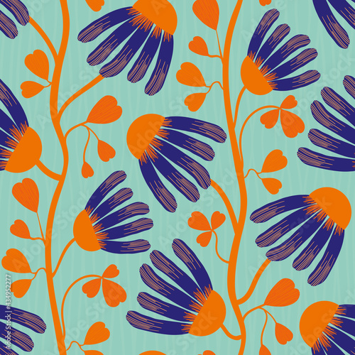 Modern Indian Floral style vector seamless pattern background. Neon orange indigo abstract echinacea flowers on winding vine with heart shaped leaves on a textured blue background.Tropical repeat