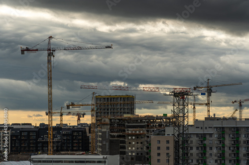 Cranes over construction site for apartment buildings, Helsinki Finland