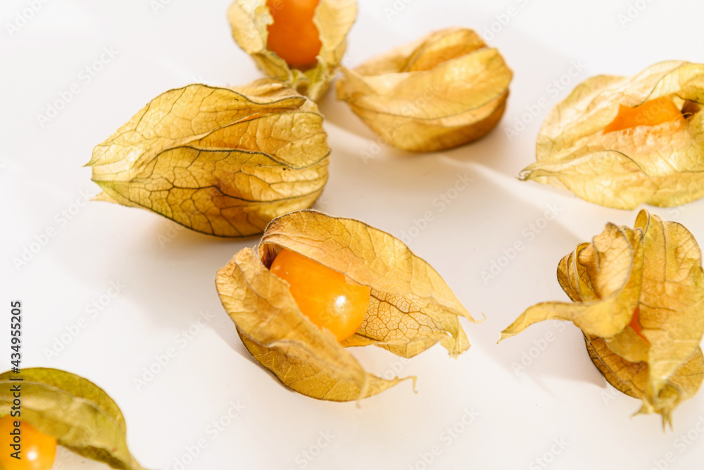 bright juicy yellow physalis berries close-up on a white background bright juicy yellow physalis berries close-up on a white background