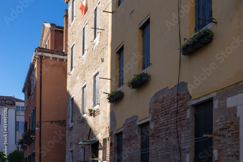 Fototapeta Naklejka Na Ścianę i Meble -  facades of the narrow streets of the old city of Venice