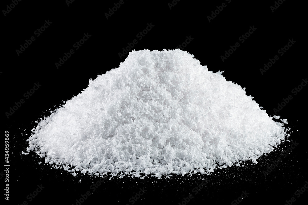 Pile of fluffy white snow isolated on a black background