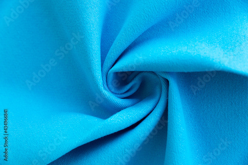 Dense light blue fabric coiled texture