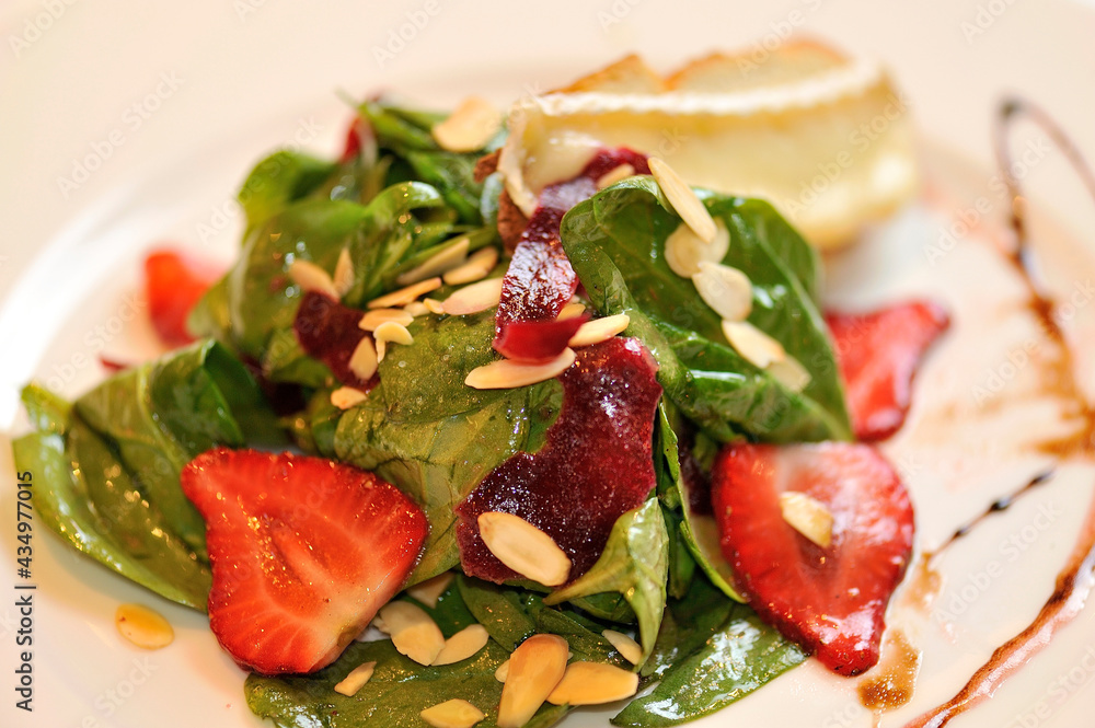 Green salad with strawberry and cheese Green salad with strawberry and cheese
