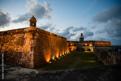 Castillo San Felipe del Morro of San Juan, Puerto Rico, a castle fortress at sunset. Generations of soldiers lived at the fort and visitors today are inspired by the stories and architecture. photo