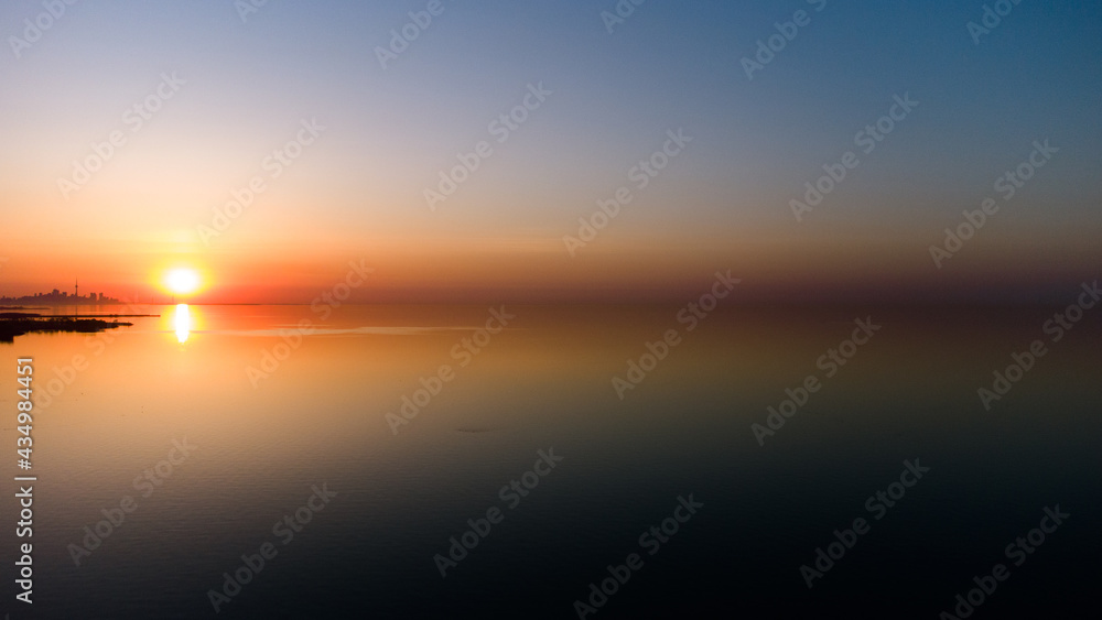 Golden Hour Sunrise sunset on the lake with orange sky Golden Hour Sunrise sunset on the lake with orange sky