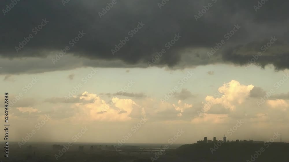 A dark cloud in the sky above the city. Thunderstorm in the city. High quality FullHD footage A dark cloud in the sky above the city. Thunderstorm in the city. High quality FullHD footage
