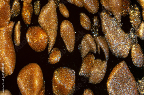 murano black glass with copper inclusions, macro shot photo