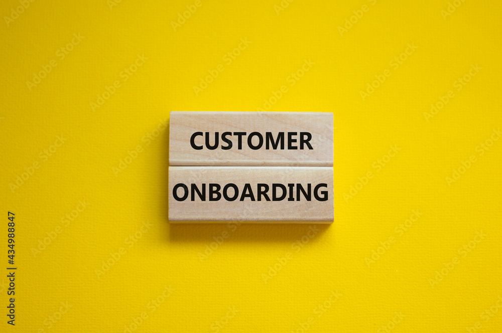 Customer onboarding success symbol. Wooden blocks with words 'Customer onboarding' on beautiful yellow background. Business and customer onboarding success concept. Copy space. Customer onboarding success symbol. Wooden blocks with words 'Customer onboarding' on beautiful yellow background. Business and customer onboarding success concept. Copy space.