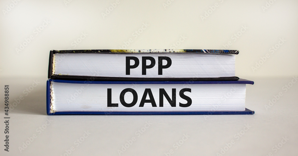 PPP, paycheck protection program loans symbol. Concept words PPP, paycheck protection program loans on books on a beautiful white background. Business, PPP paycheck protection program loans concept.