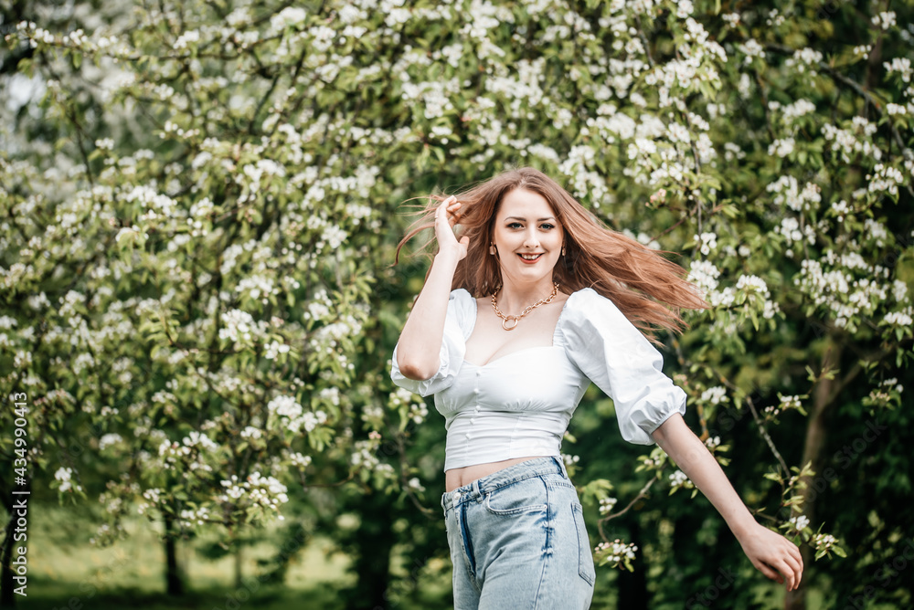 beautiful young blonde woman standing near the apple tree beautiful young blonde woman standing near the apple tree