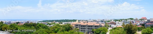 Aerial view of Naha city and sea shore from Shurijo castle in Okinawa, japan. Panorama - 沖縄 那覇市の街並みと海 © Eric Akashi