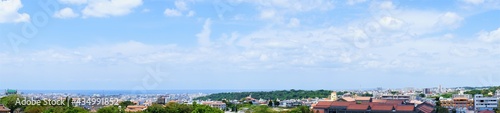 Aerial view of Naha city and sea shore from Shurijo castle in Okinawa, japan. Panorama - 沖縄 那覇市の街並みと海 © Eric Akashi