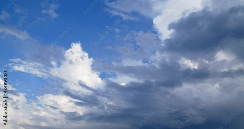 Dark, heavy clouds cover the white clouds and the blue sky. Dark, heavy clouds cover the white clouds and the blue sky.