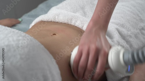 Close up of professional cosmetologist taking a nozzle for vacuum massage