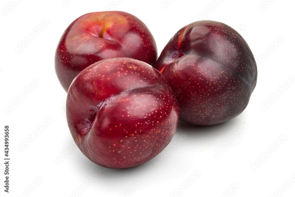 Fresh red plums, isolated on white background. High resolution image.