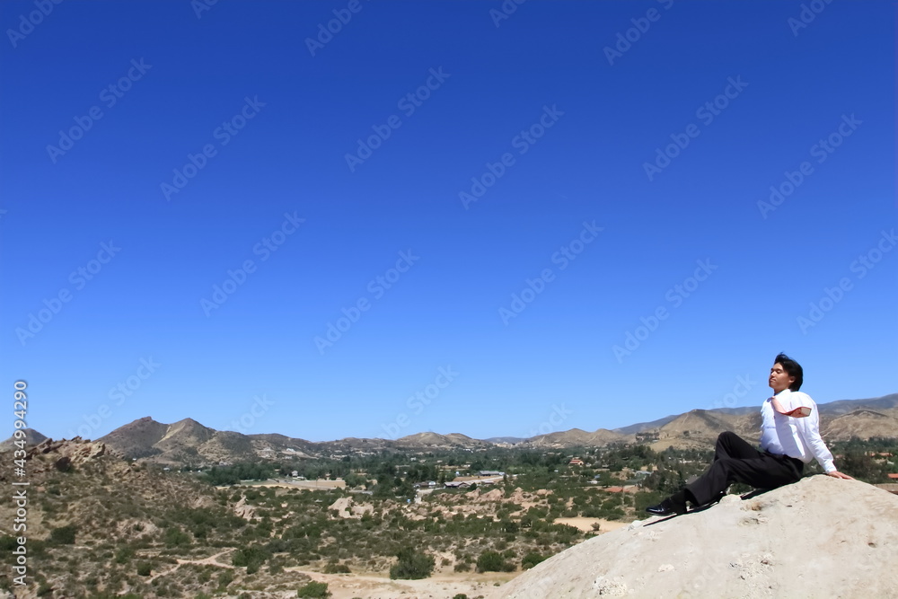 A young businessman relaxing in the desert