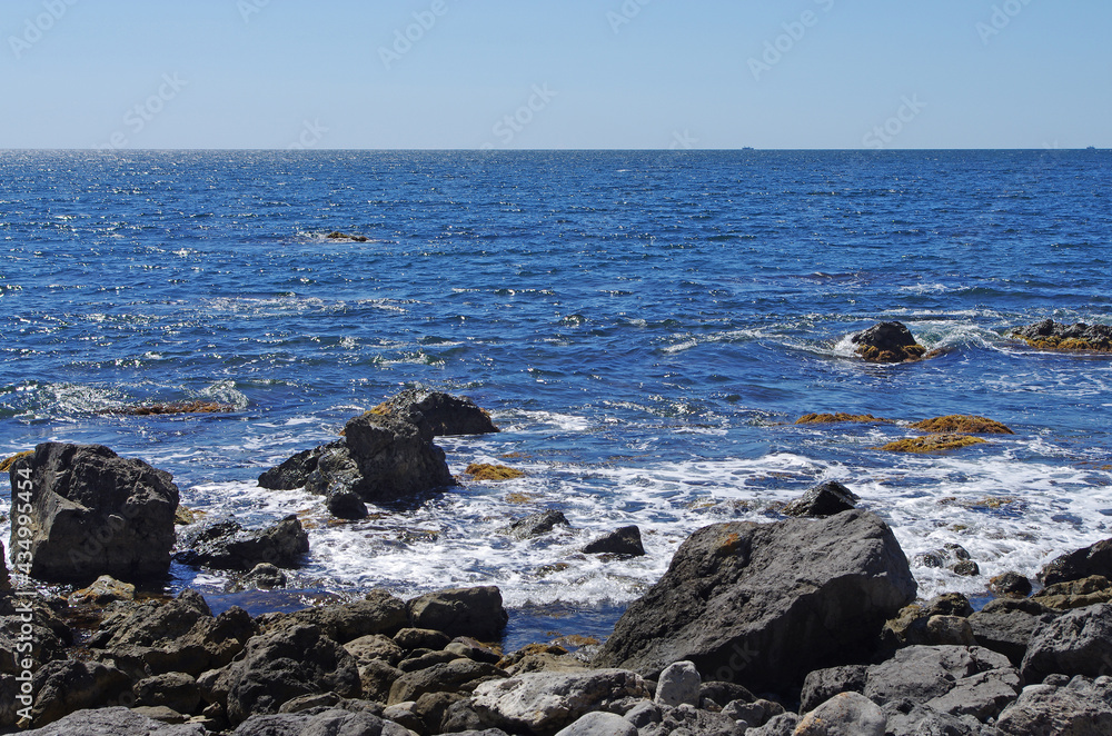 Sea rocky coast abstract background of water surface with splashes