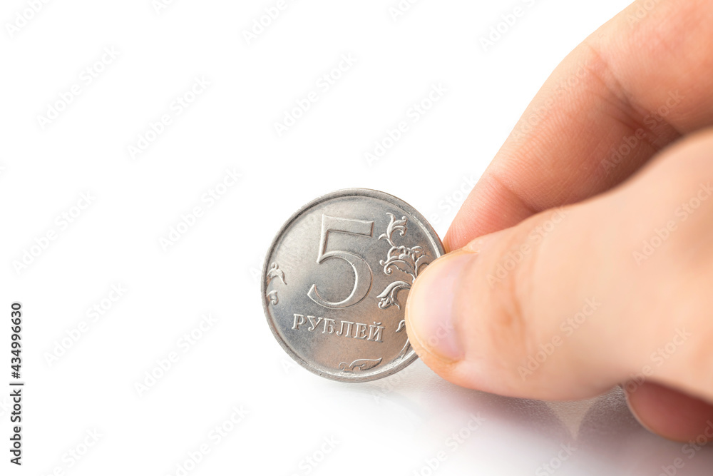 5 russian ruble coin in hand isolated on a white background 5 russian ruble coin in hand isolated on a white background