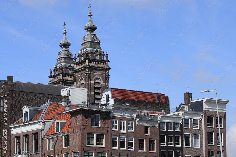 Amsterdam Brown Brick House Facades with St. Nicholas Church Towers