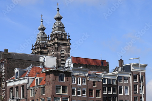 Amsterdam Brown Brick House Facades with St. Nicholas Church Towers