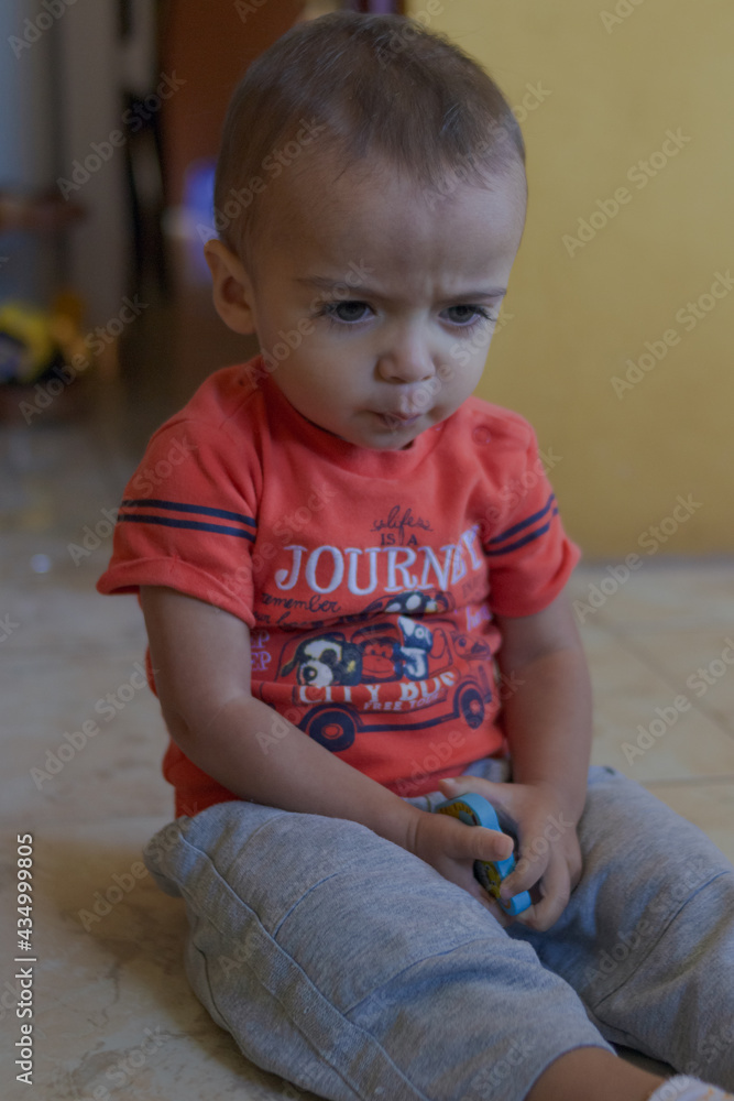 portrait of little boy angry with his toys portrait of little boy angry with his toys